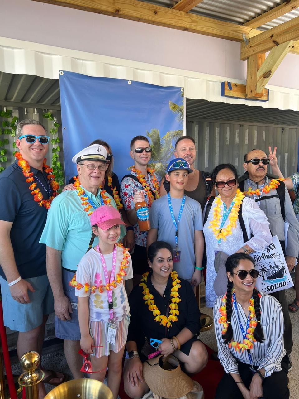 Birthday squad off the ship, leis on, ready to roll.