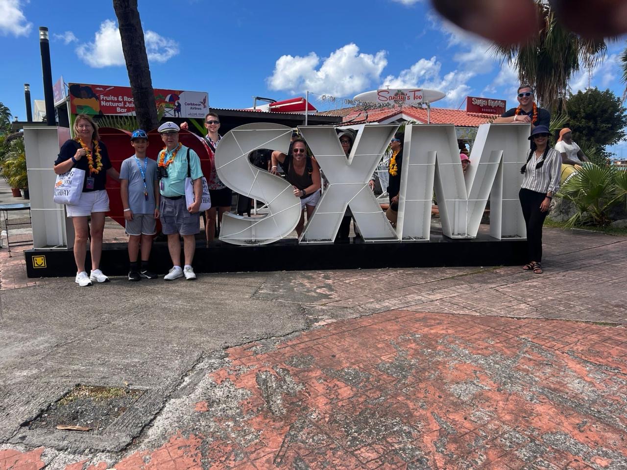 Cruise guests at the I♥SXM sign on the Philipsburg boardwalk.